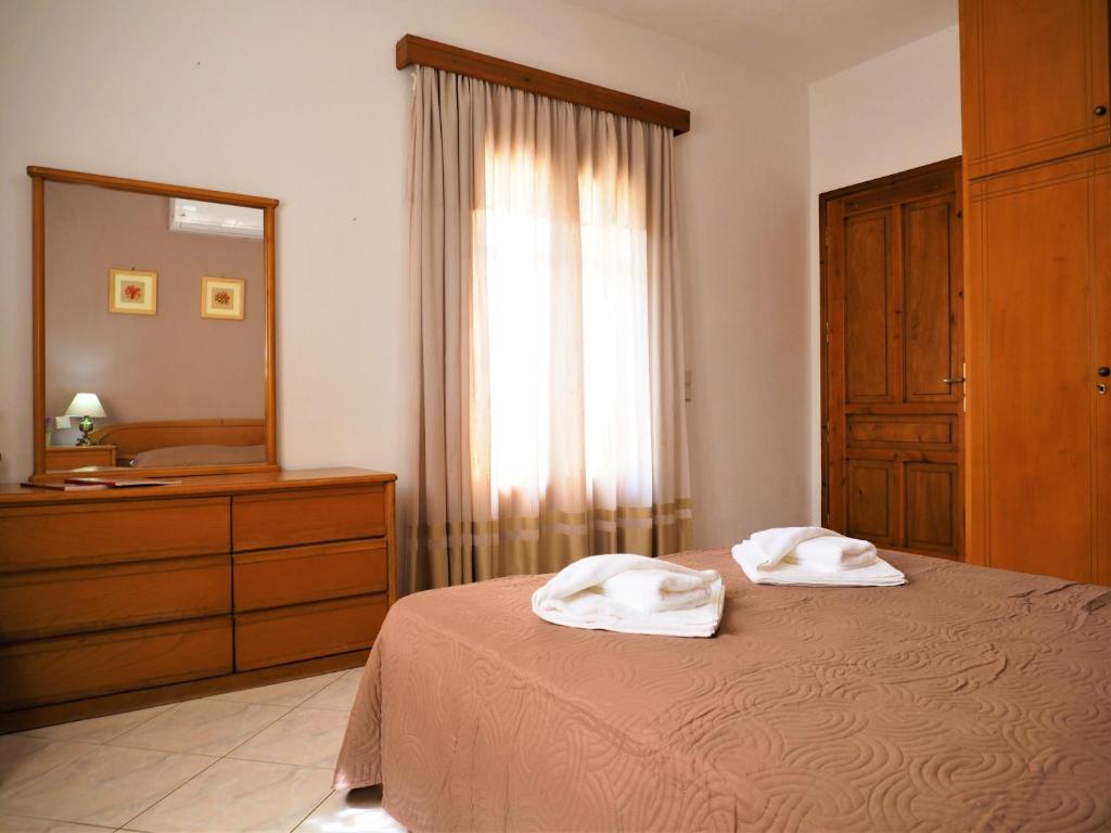 Posteľ alebo postele v izbe v ubytovaní Traditional Cretan Villa