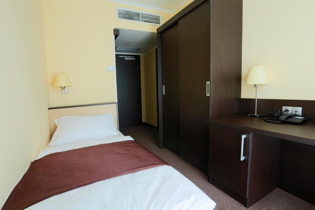 Postel nebo postele na pokoji v ubytování Casino & Hotel ADMIRAL Ptuj