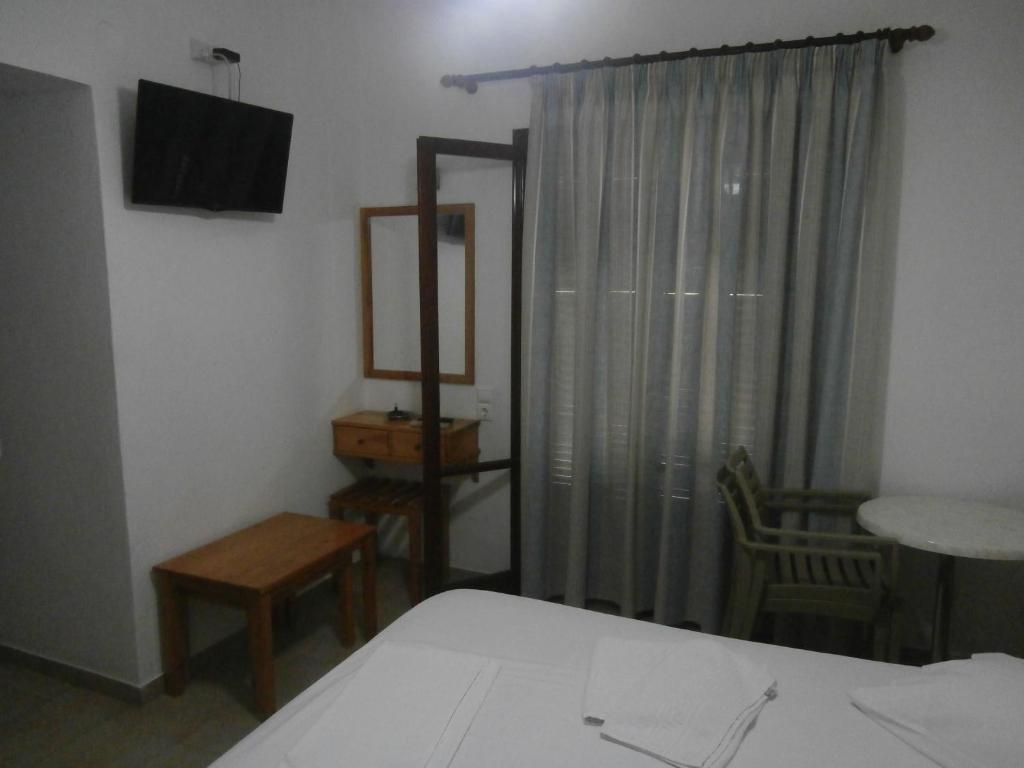 Łóżko lub łóżka w pokoju w obiekcie Hotel Aris