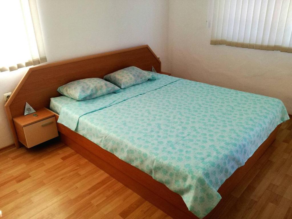 Postel nebo postele na pokoji v ubytování Apartment Stoyanovi