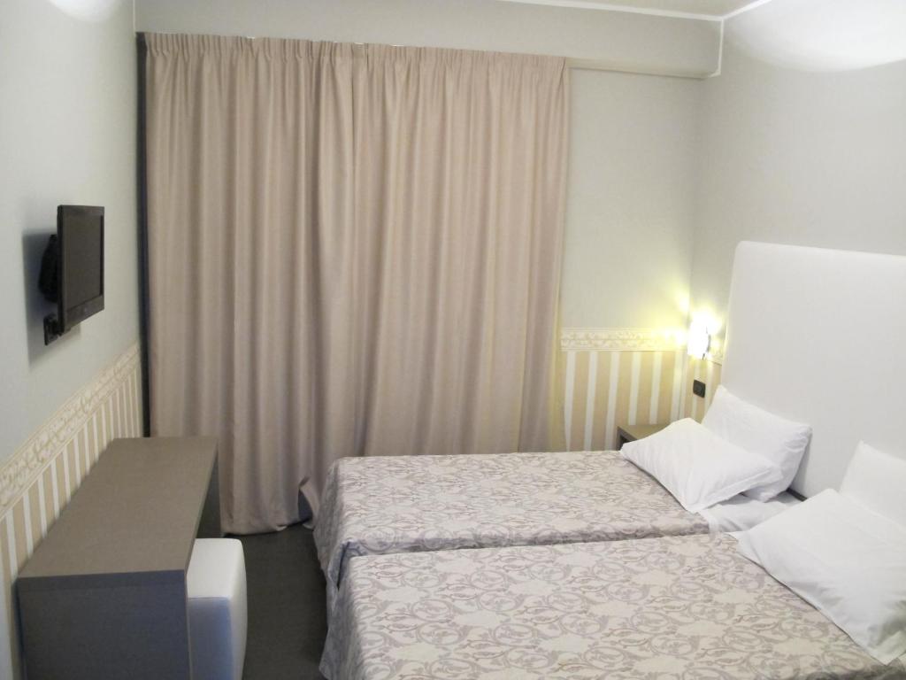 Postel nebo postele na pokoji v ubytování Hotel Laguna Residence