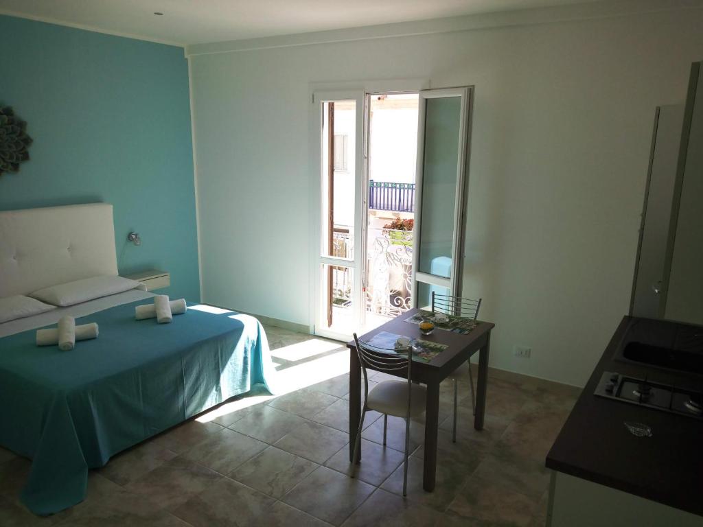 A bed or beds in a room at Holiday Homenza