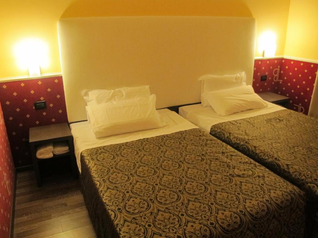 Postel nebo postele na pokoji v ubytování Hotel Laguna Residence