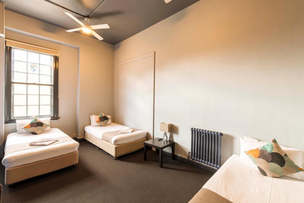 Postel nebo postele na pokoji v ubytování Hotel Canobolas