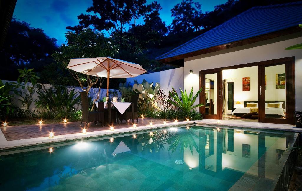La pileta dentro o cerca de Kebun Villas & Resort