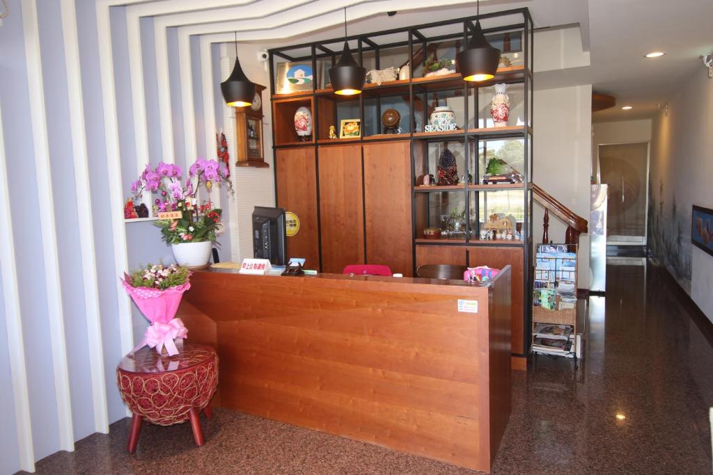 a restaurant with a counter in a room at Kenting Waterfront Hotel in Kenting