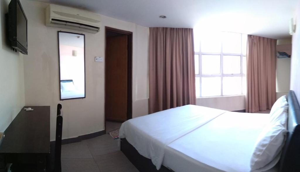 Postel nebo postele na pokoji v ubytování Starview Hotel