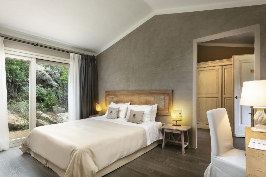 Postel nebo postele na pokoji v ubytování Petra Segreta Resort & Spa
