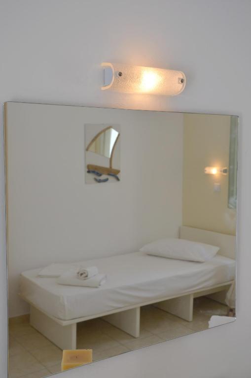 Postel nebo postele na pokoji v ubytování Galaxy Hotel