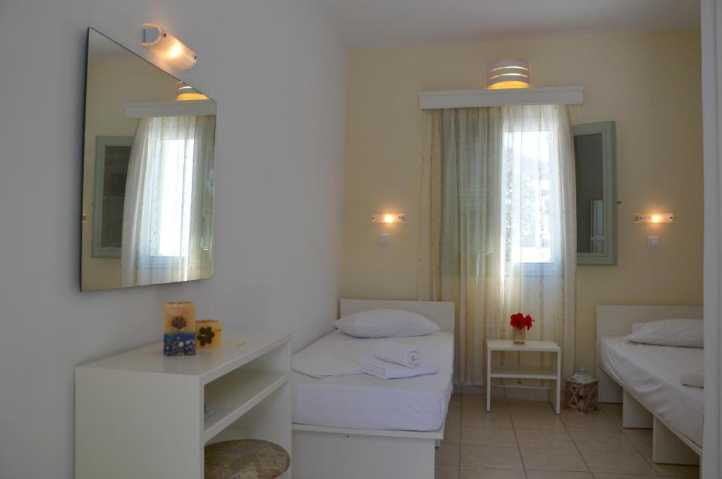 Postel nebo postele na pokoji v ubytování Galaxy Hotel