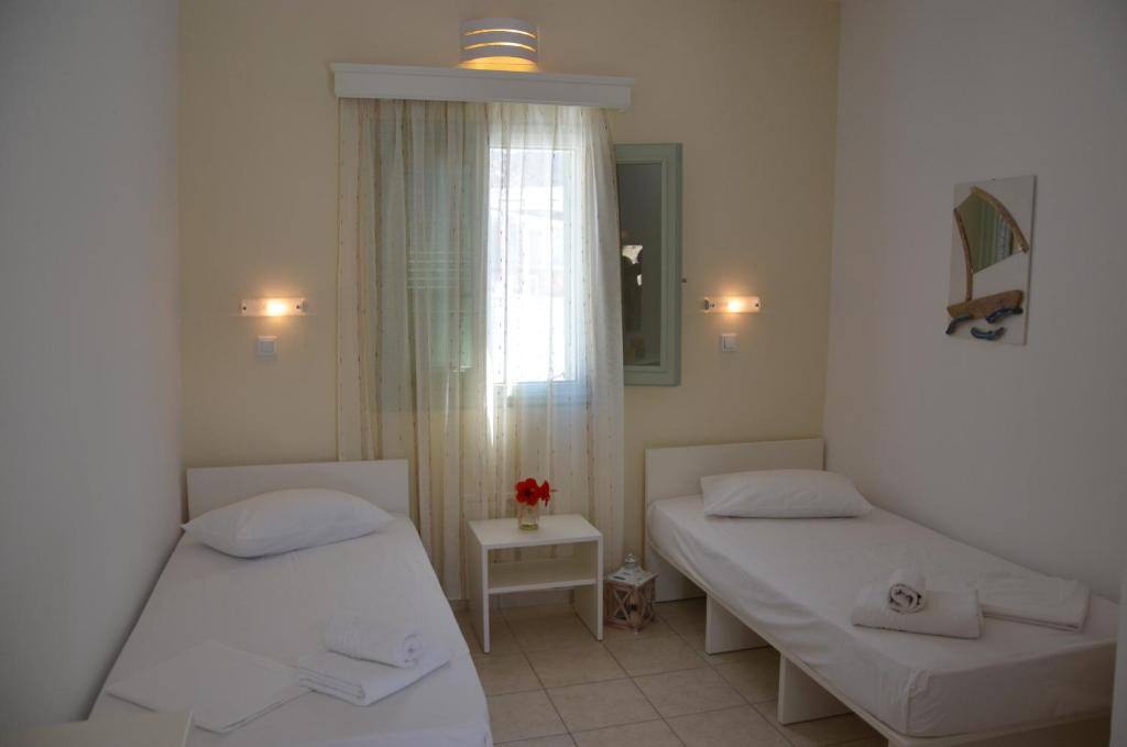 Postel nebo postele na pokoji v ubytování Galaxy Hotel