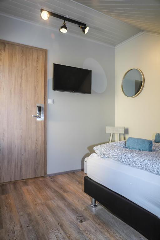 Postel nebo postele na pokoji v ubytování Lava Guesthouse