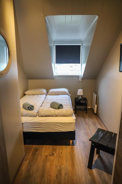 Postel nebo postele na pokoji v ubytování Lava Guesthouse