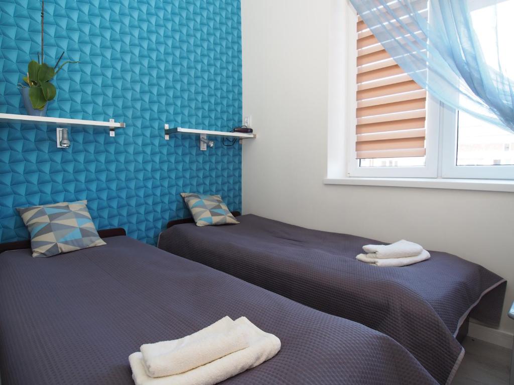Posteľ alebo postele v izbe v ubytovaní Grand-Tourist Center Point Apartments
