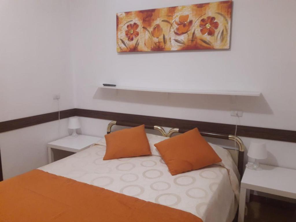 Postel nebo postele na pokoji v ubytování Albergo Ollolai