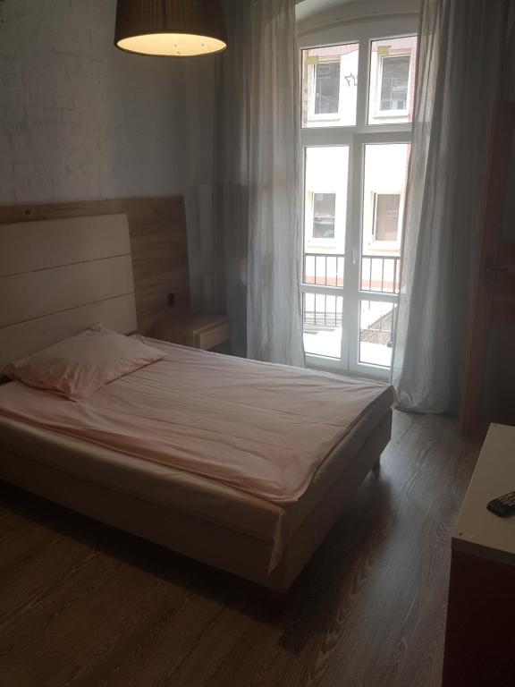 Postel nebo postele na pokoji v ubytování Kaktus Guest House
