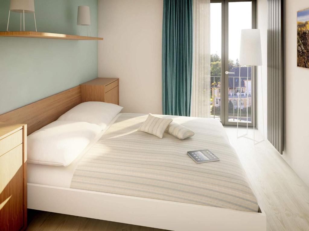 Postel nebo postele na pokoji v ubytování Apartmán Krásná Lípa č. 1