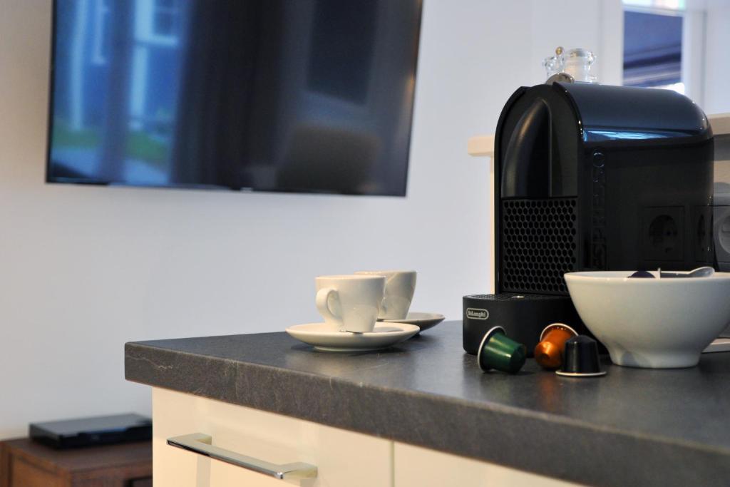 Kuchyň nebo kuchyňský kout v ubytování Rackmers Hof - Suiten Hotel garni mit Sauna