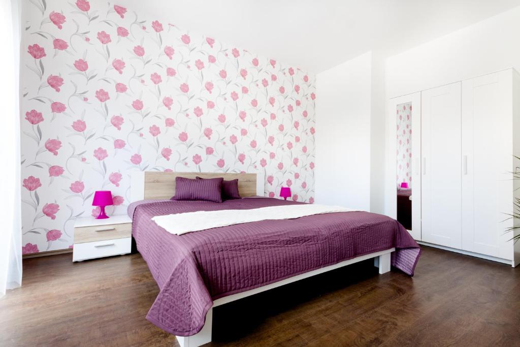 Posteľ alebo postele v izbe v ubytovaní Grand Budapest Penthouse