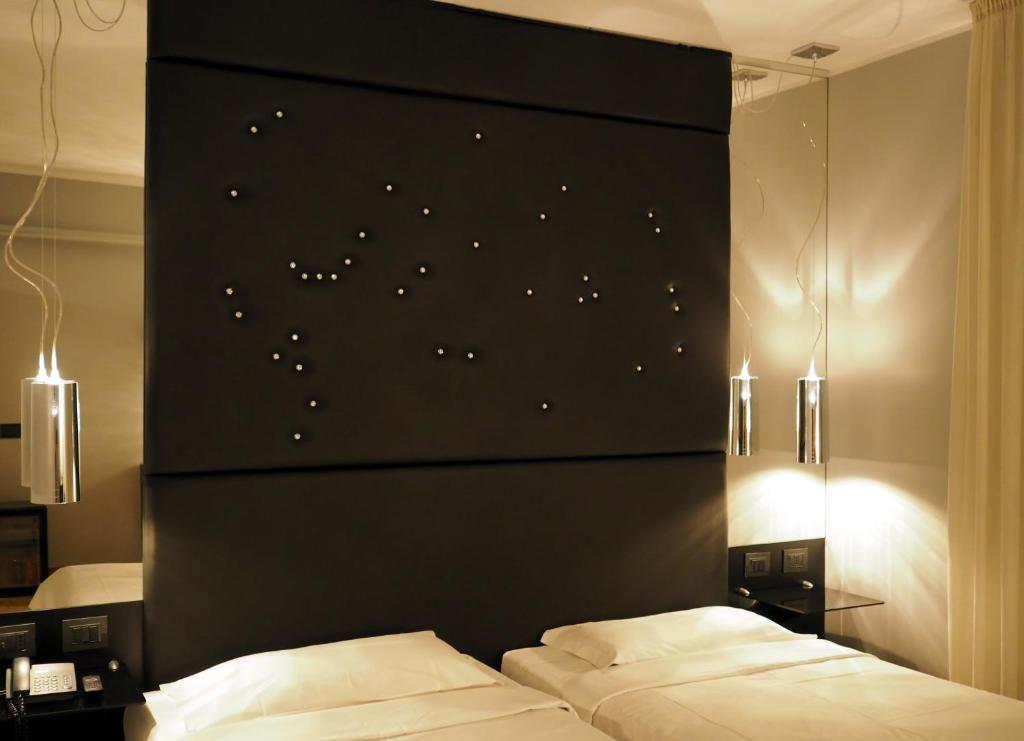Postel nebo postele na pokoji v ubytování Corte Ongaro Hotel