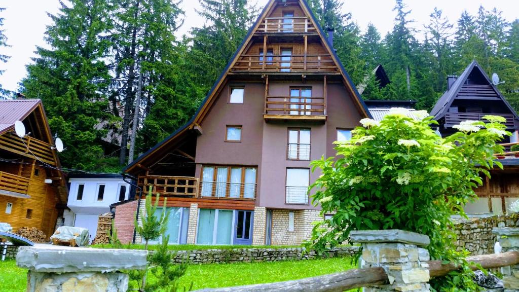 a large house with a thatched roof at Vlasic Nana & Lalla in Vlasic