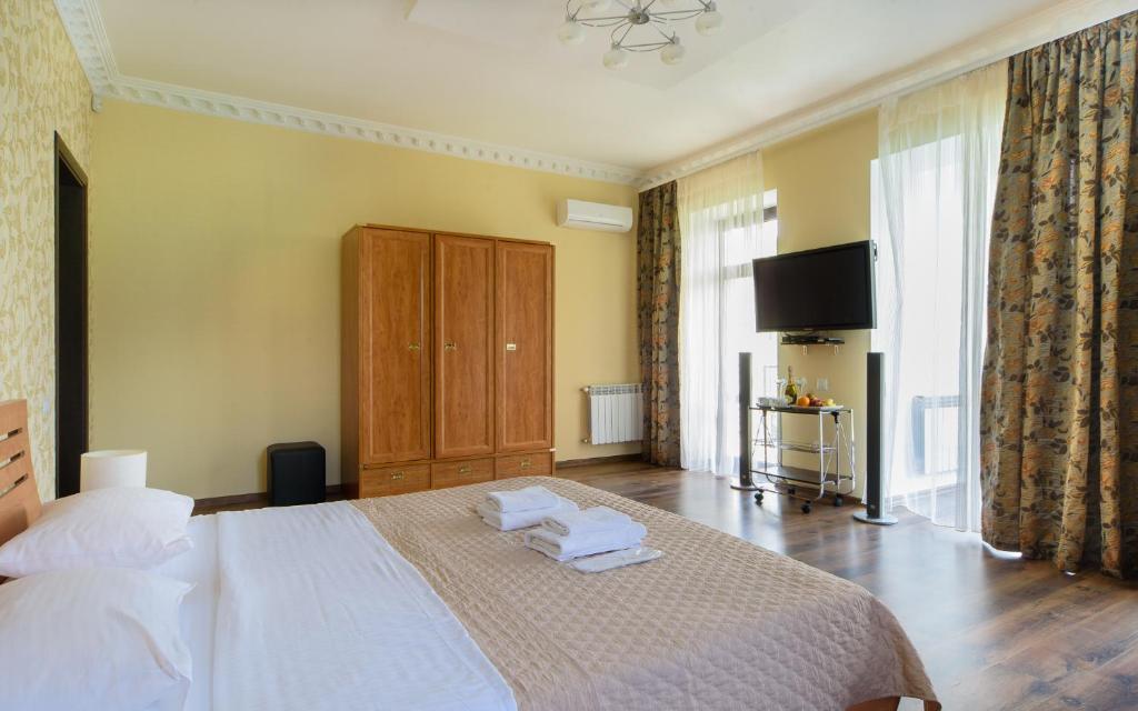 Postel nebo postele na pokoji v ubytování Hotel Fusion