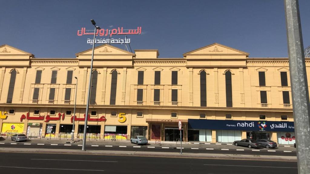 a large building on the side of a street at Al Salam Royal Hotel Suites in Taif