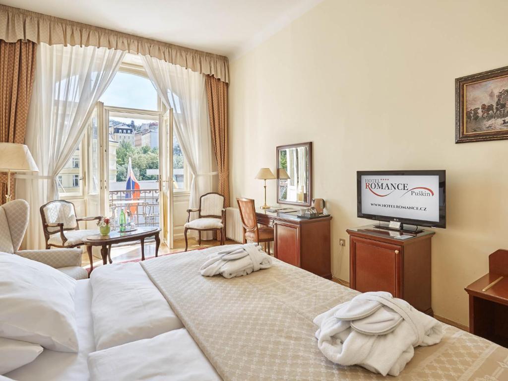 Voodi või voodid majutusasutuse Hotel Romance toas