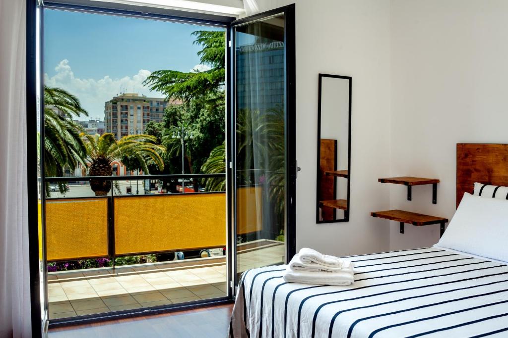 A bed or beds in a room at Travel B&B