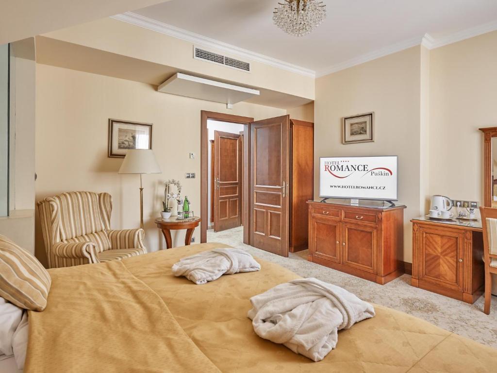 Voodi või voodid majutusasutuse Hotel Romance toas