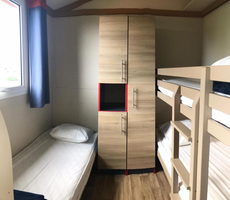Postel nebo postele na pokoji v ubytování Camping Trinité