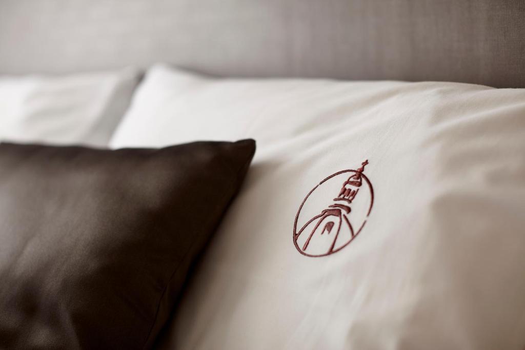 Postel nebo postele na pokoji v ubytování Hotel Central Basilica