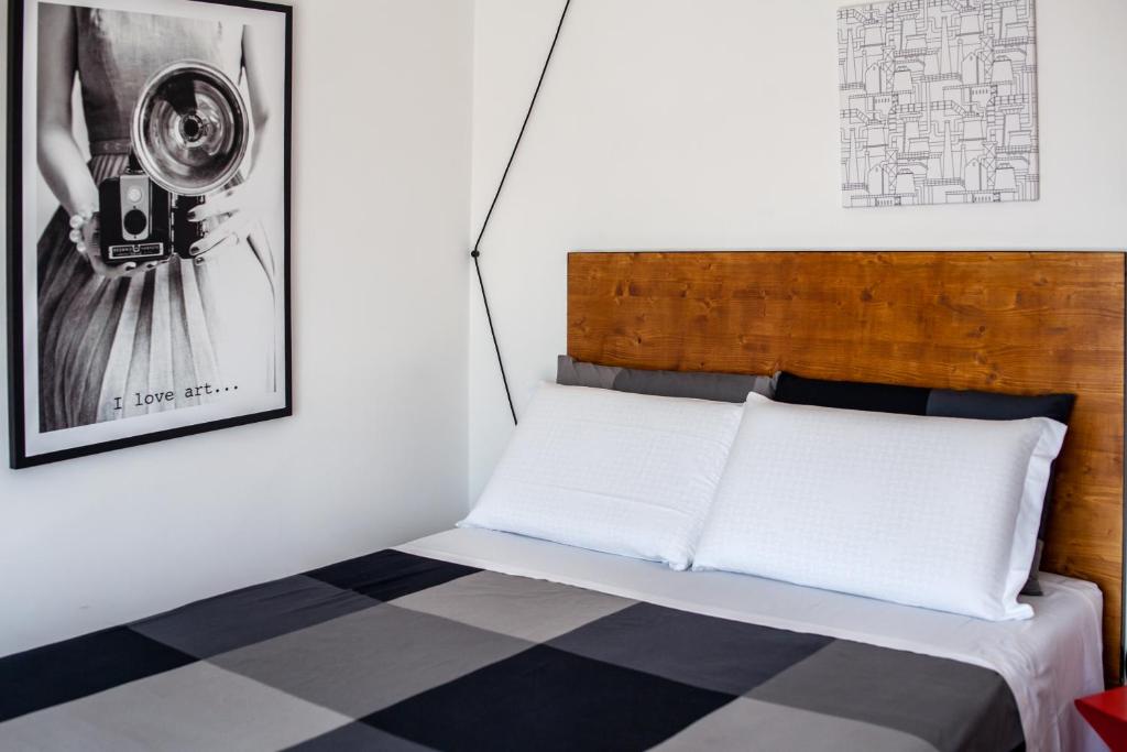 A bed or beds in a room at Travel B&B