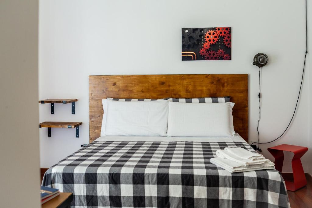 A bed or beds in a room at Travel B&B