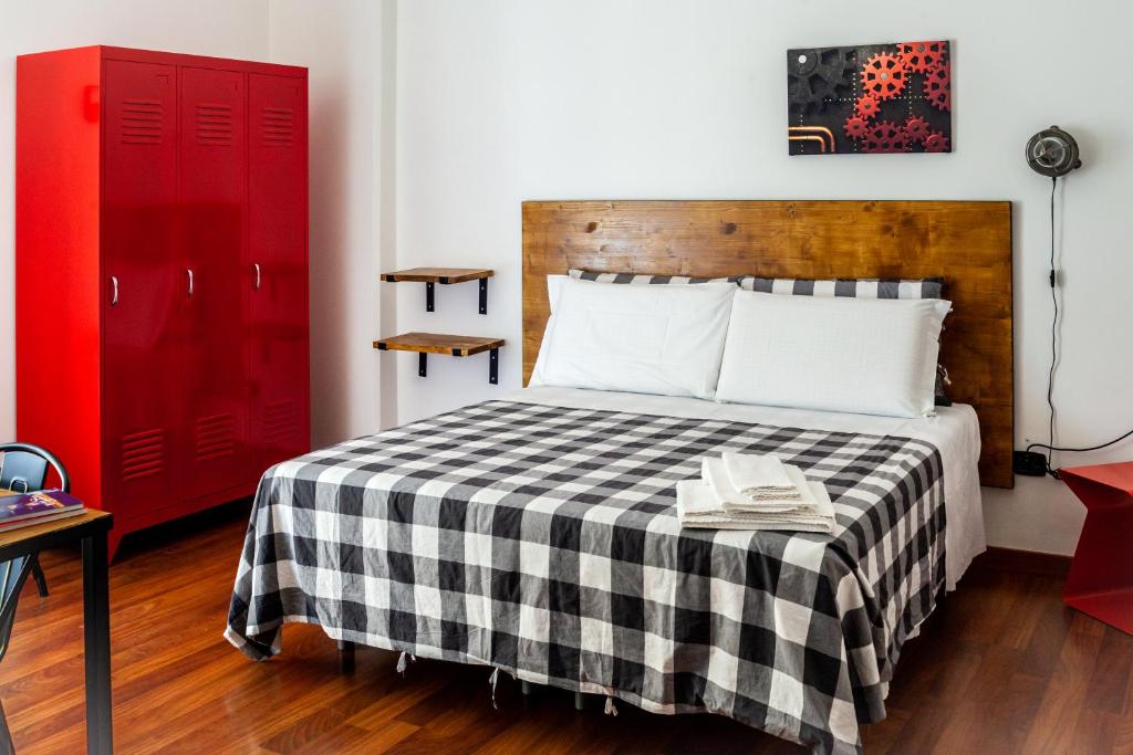 A bed or beds in a room at Travel B&B