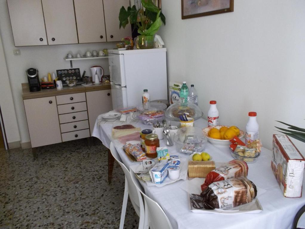 a table with food on it in a kitchen at Victoria in Catania