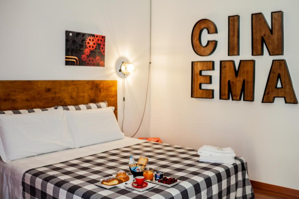 A bed or beds in a room at Travel B&B