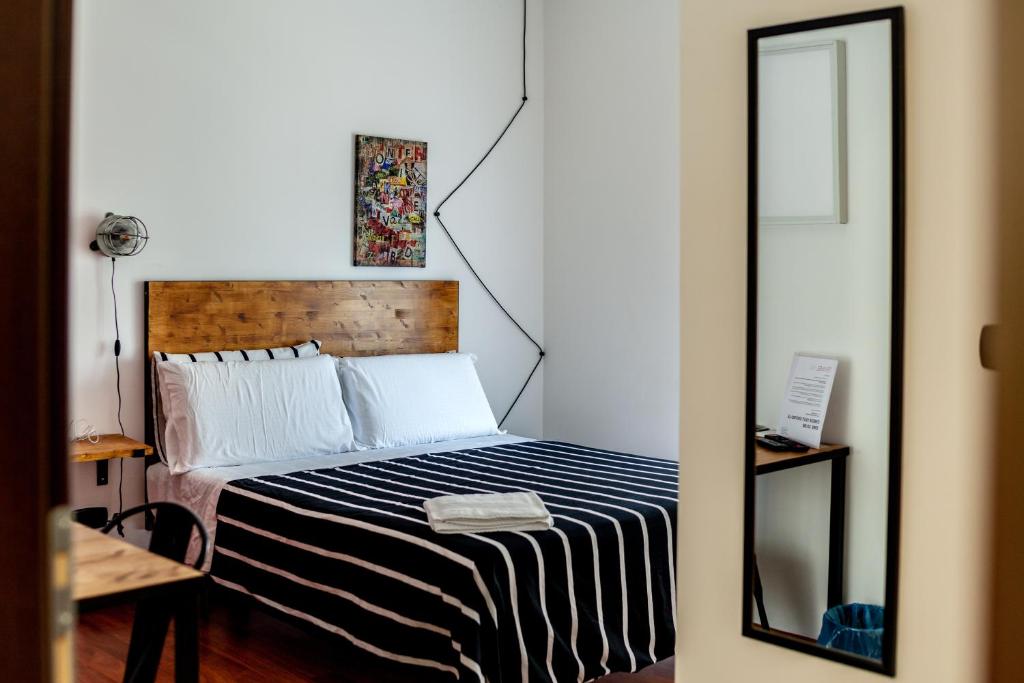 A bed or beds in a room at Travel B&B