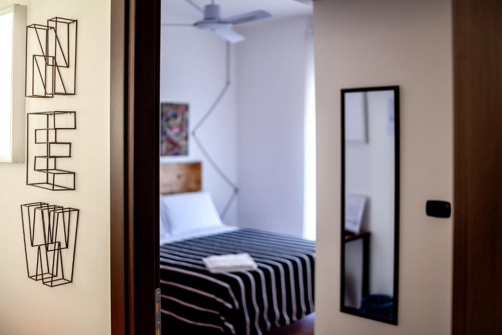 A bed or beds in a room at Travel B&B