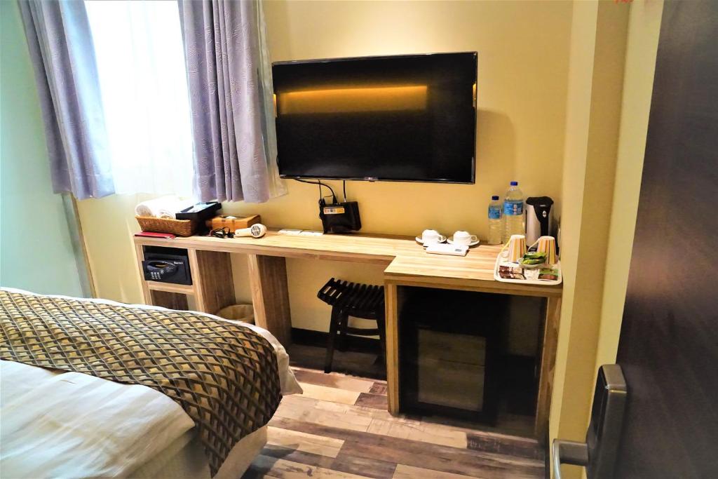TV a/nebo společenská místnost v ubytování Dahshin Hotel