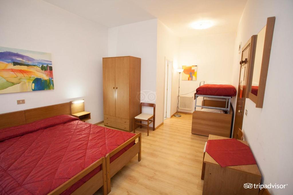 Postel nebo postele na pokoji v ubytování Hotel Caprera