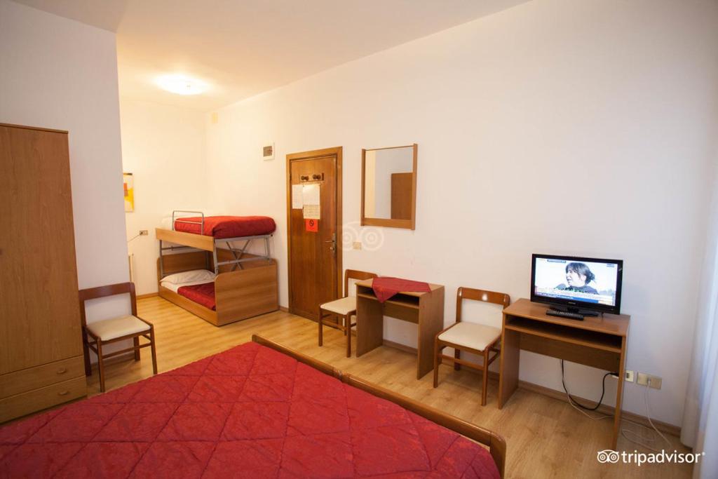 Postel nebo postele na pokoji v ubytování Hotel Caprera