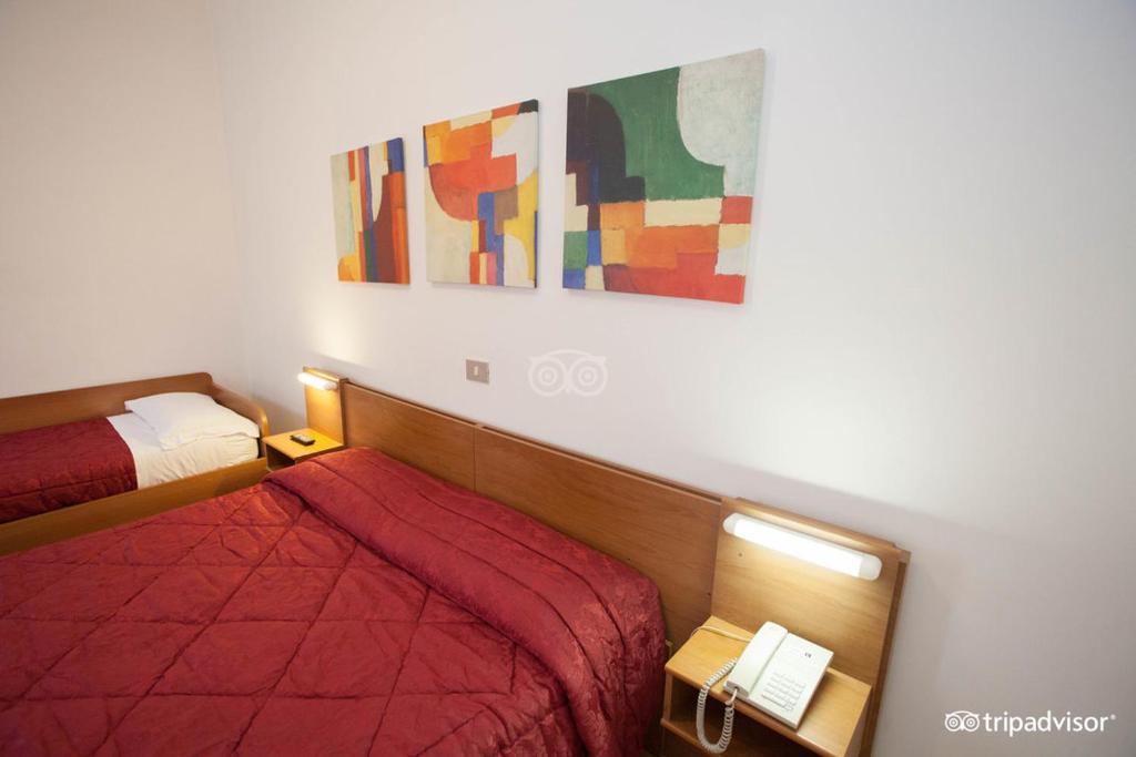 Postel nebo postele na pokoji v ubytování Hotel Caprera