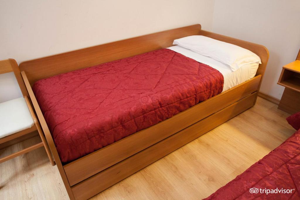 Postel nebo postele na pokoji v ubytování Hotel Caprera
