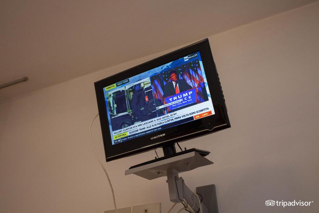 TV a/nebo společenská místnost v ubytování Hotel Caprera