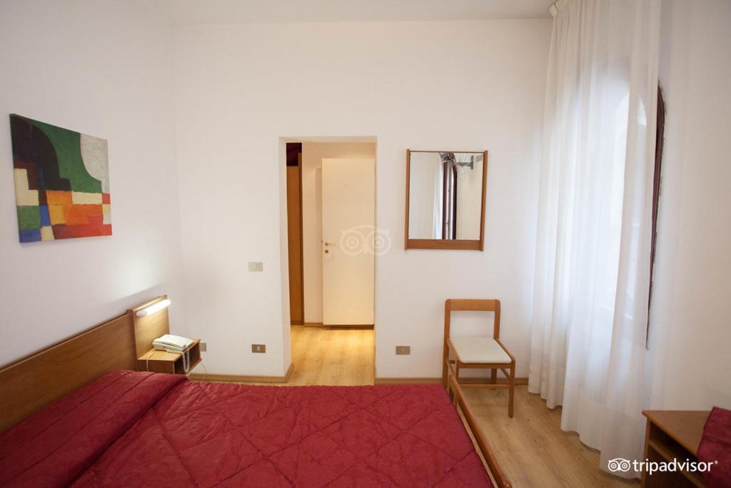 Postel nebo postele na pokoji v ubytování Hotel Caprera