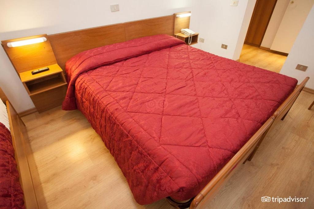 Postel nebo postele na pokoji v ubytování Hotel Caprera