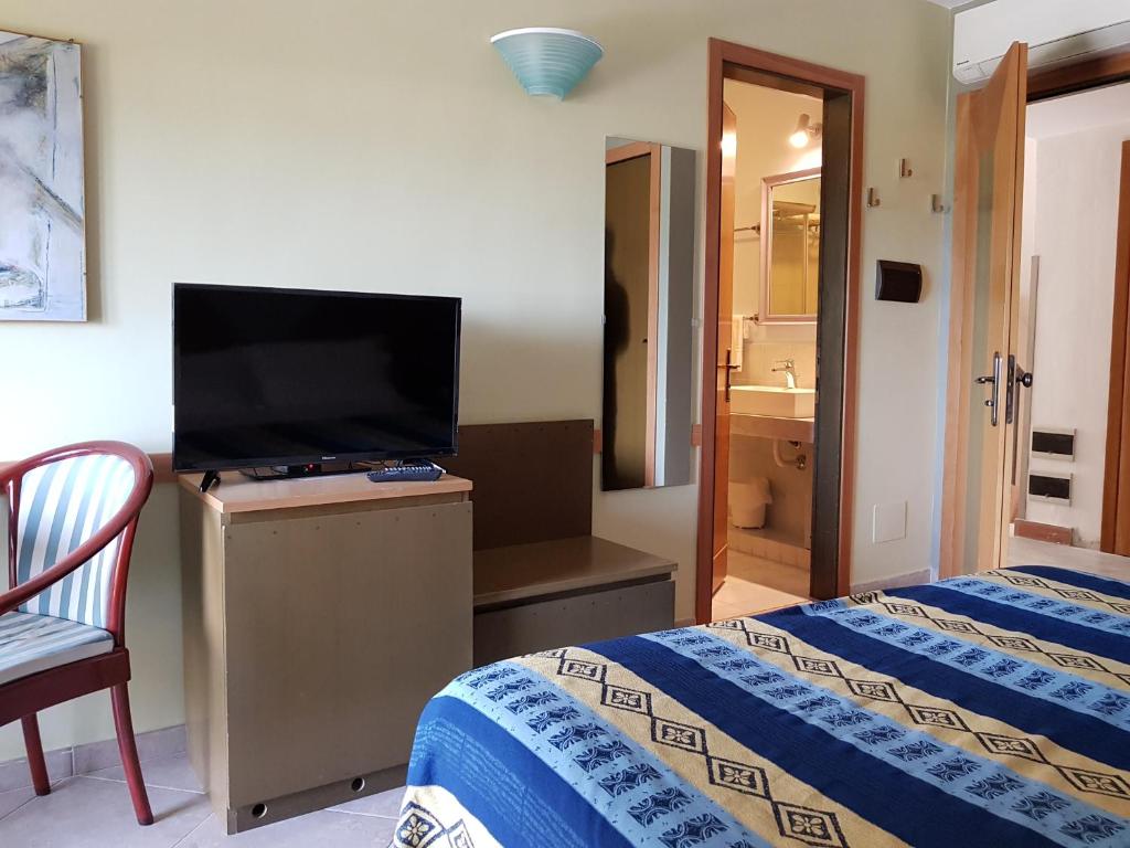 Postel nebo postele na pokoji v ubytování Addaura Village e Congressi