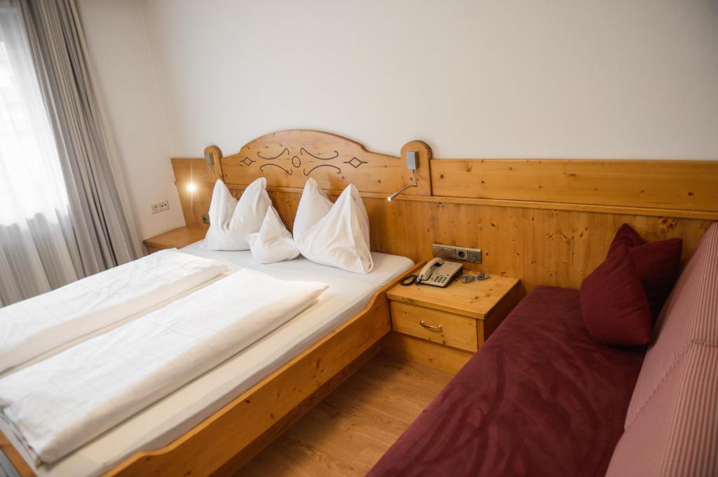 Postel nebo postele na pokoji v ubytování Hotel Rochushof