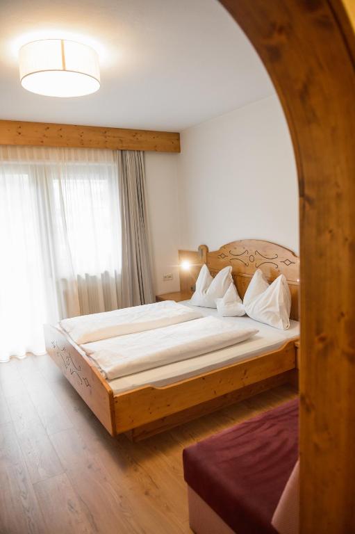 Postel nebo postele na pokoji v ubytování Hotel Rochushof